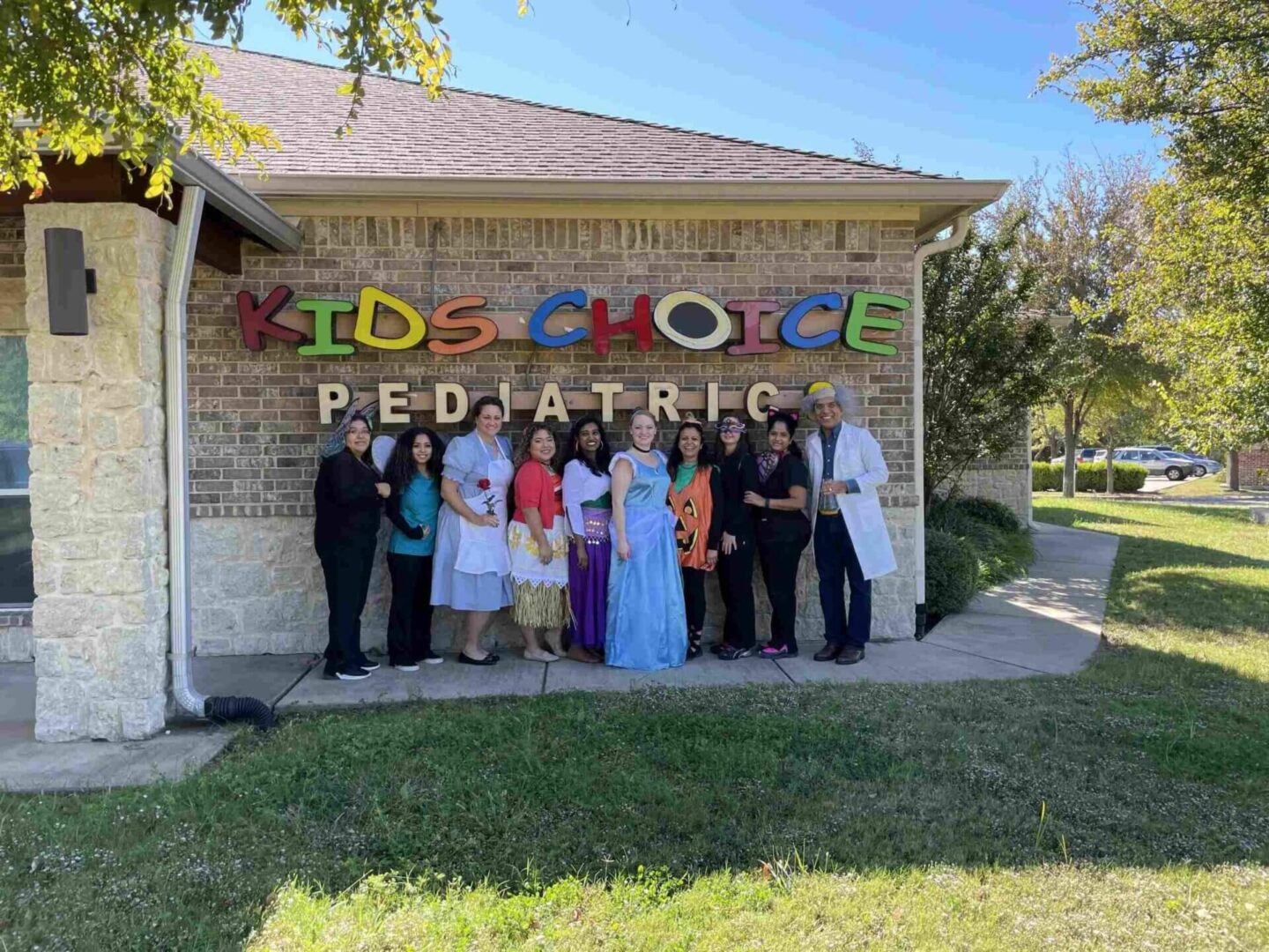 A group of people standing in front of a building.